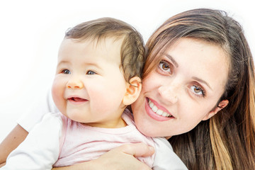 close-up of a smiling young woman with her baby on white background