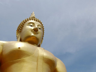 Huge gold buddha statue at temple in Thailand