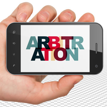 Law concept: Hand Holding Smartphone with Arbitration on  display