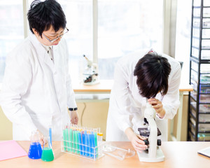Asian female scientists in lab