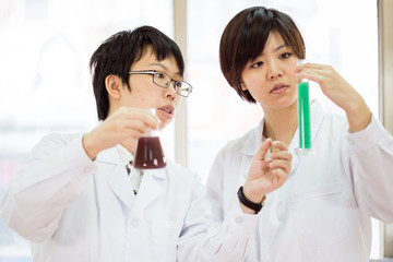 Asian female scientists in lab