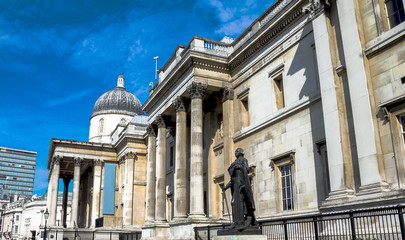 Unidentified  tourists near  National Gallery in Trafalgar Squar