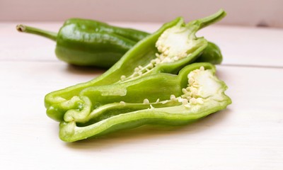 Green pepper in a cut on a white background