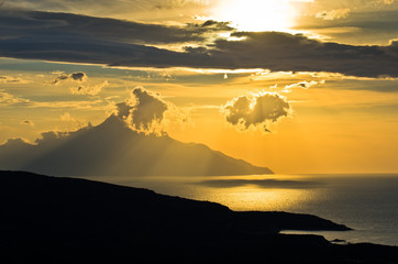 Greek coast of aegean sea at sunrise near holy mountain Athos