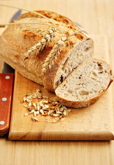 Freshly baked traditional bread on wooden board