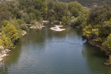 A Swimming Hole in the River L'Herault. The river L'Herault is a beautiful meandering river in the south of France. In summer its many swimming holes are visted by people on their summer holidays.