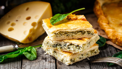 Homemade pie stuffed with cheese and spinach