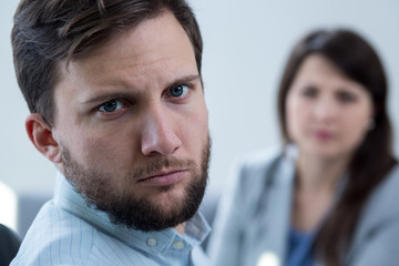 Stressed man during psychotherapy