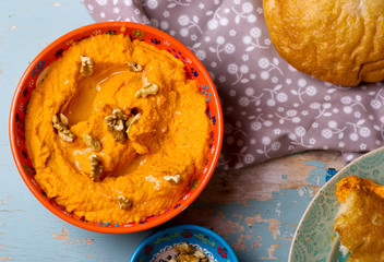 carrot dip with a flat cake.