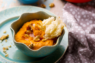 carrot dip with a flat cake.