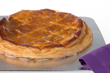 French three kings cake eaten on epiphany day, on a white background