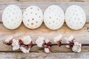 Beautiful unique Easter eggs on wooden background