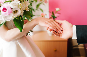 Bride and groom holding hands