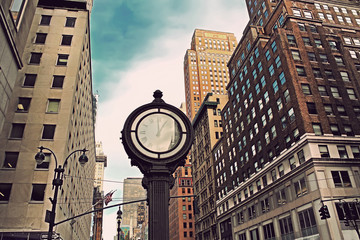 Fototapeta na wymiar Fifth Avenue building in New York City and big clock