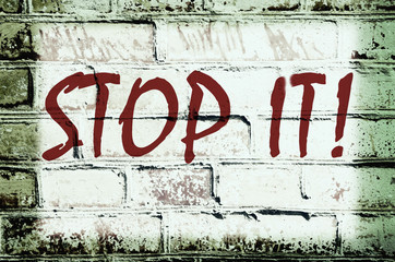 Wall with graffiti that says 
