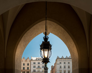 Old lamp and Krakow architecture. Poland, Europe.