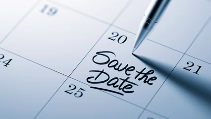 Fotobehang Closeup of a personal agenda setting an important date written w © xtock
