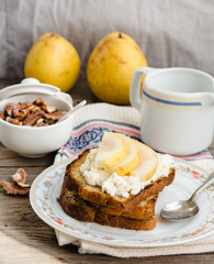 toast for breakfast with sweet cream cheese and pear, a cup of c