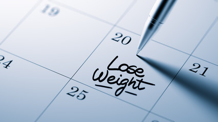 Closeup of a personal agenda setting an important date written w