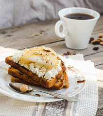 toast for breakfast with sweet cream cheese and pear,coffee, rus