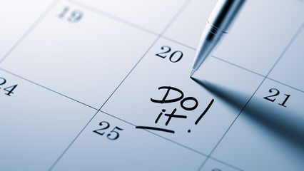 Closeup of a personal agenda setting an important date written w