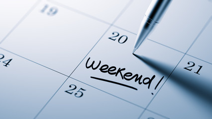 Closeup of a personal agenda setting an important date written w