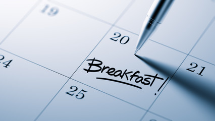 Closeup of a personal agenda setting an important date written w