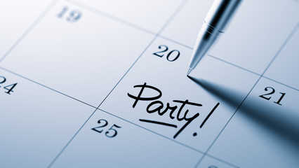 Closeup of a personal agenda setting an important date written w