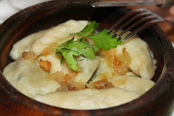 Varenyky with fried slices of bacon