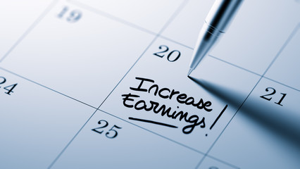 Closeup of a personal agenda setting an important date written w