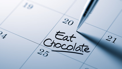 Closeup of a personal agenda setting an important date written w