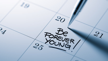 Closeup of a personal agenda setting an important date written w