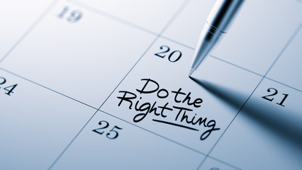 Closeup of a personal agenda setting an important date written w