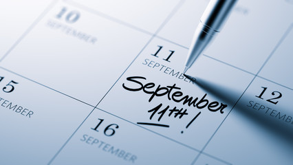 Closeup of a personal agenda setting an important date written w