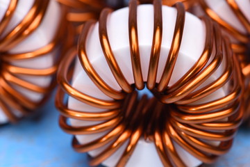 Macro of a copper coils on blue background
