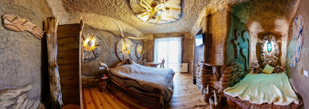 Unique ethnic interior. Traditional, national, design. The hotel room. Ukrainian style and specific decorations of Trypillian culture period. Ancient Ukraine. Europe, Carpathians, Hotel History.