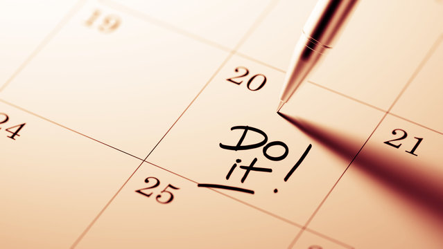 Closeup of a personal agenda setting an important date written w