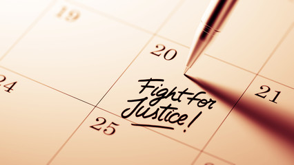 Closeup of a personal agenda setting an important date written w