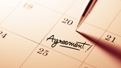 Closeup of a personal agenda setting an important date written w