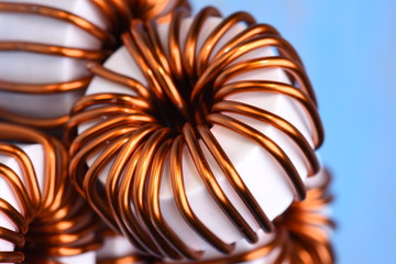Macro of a copper coils on blue background
