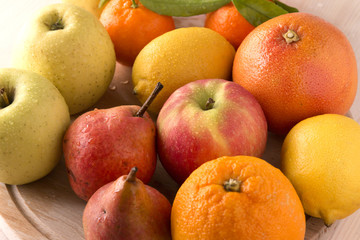 Fresh fruits on wooden board