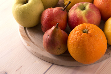 Fresh fruits on wooden board