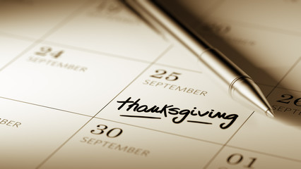 Closeup of a personal agenda setting an important date written w