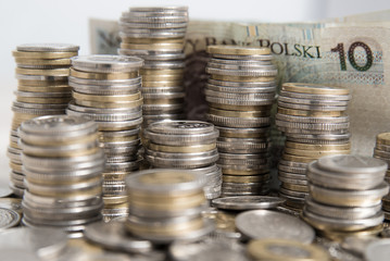 Money in piles on background Polish banknotes.
