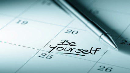 Closeup of a personal agenda setting an important date written w