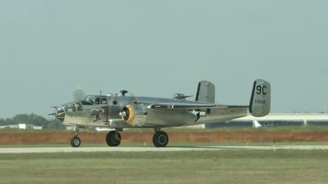 B-24 Liberator from World War II taxiing towards camera at airfield.  Recorded in 4K, ultra high definition.