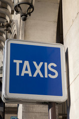 Blue Taxi Sign in Paris Street, France