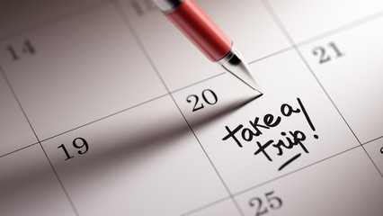 Closeup of a personal agenda setting an important date written w