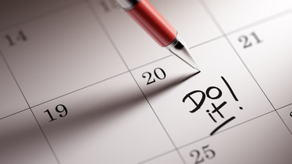 Closeup of a personal agenda setting an important date written w