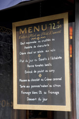 French Menu Hanging in Restaurant in Paris, France